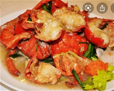 Kreeft  met gember en bosuitjes姜葱焗龙虾