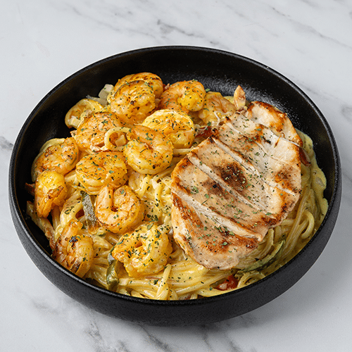 Creamy cajun grilled chicken en shrimp pasta