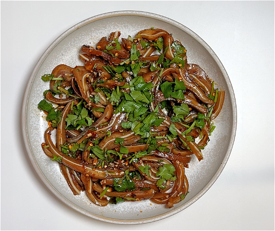Fried pig ears with coriander, sesame sauce and chili/ 卤猪耳配香菜、芝麻酱和辣椒